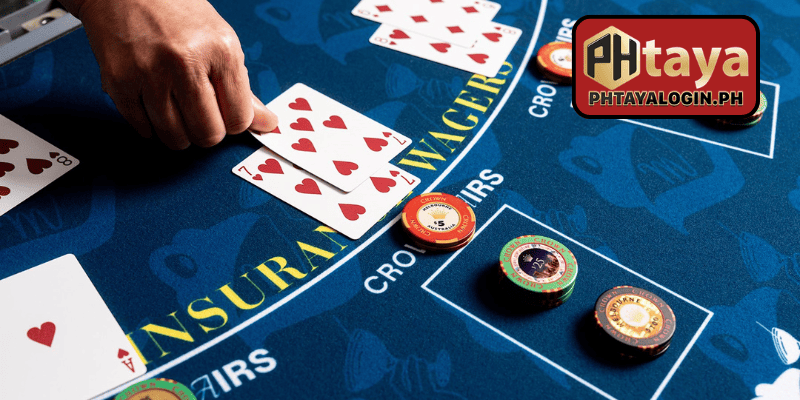 Digital blackjack table interface on PHTaya showing player cards and dealer hand
